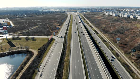 From Above of Modern Multi Lane Roadway with Car Traffic in Contemporary Megalopolis in Sunny Autumn