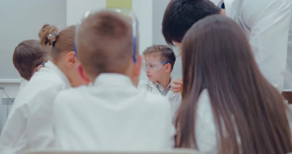 Teacher Prepares 3d Pens for Drawing in the Laboratory alt