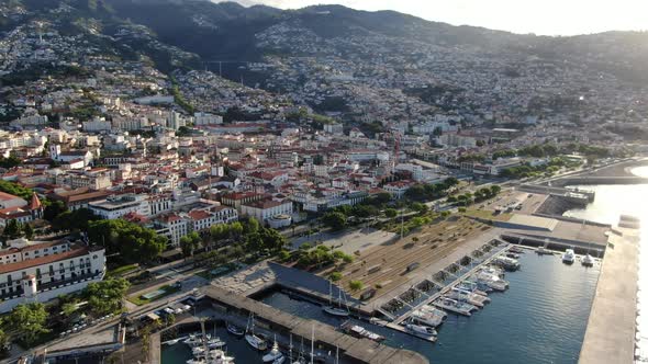 Flying over Funchal Marina and Praca do Povo on Madeira island in Portugal alt