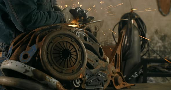 Locksmith Sands the Decorative Metal Steampunk Fish Sculpture By Electric Grinder with a Lot of alt