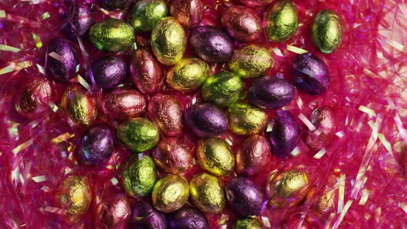 Rotating shot of colorful Easter candies on a bed of easter grass  alt