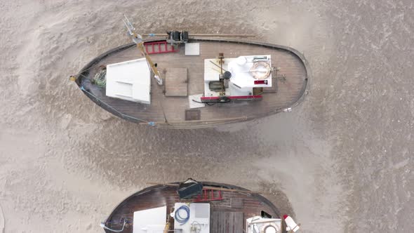 Old Fishing Boats Ashore on Thorup Strand Beach in Denmark alt