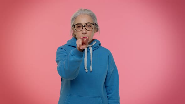 Elderly Woman Pointing at Her Eyes and Camera Show I Am Watching you Gesture Spying on Someone alt