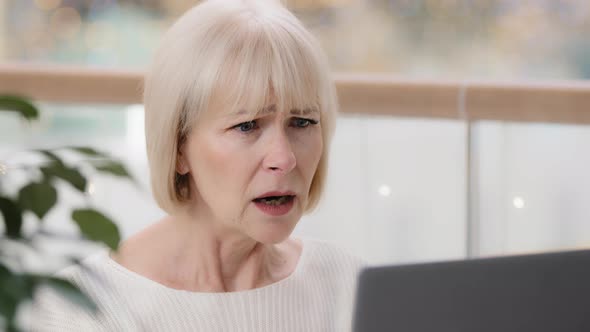 Closeup Frustrated Mature Businesswoman Looking at Laptop Screen Reading Email Stunned Shocked By alt