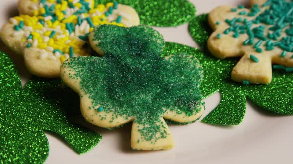 Rotating stock footage shot of St Patty's Day clovers on a white surface - ST PATTYS 015 alt