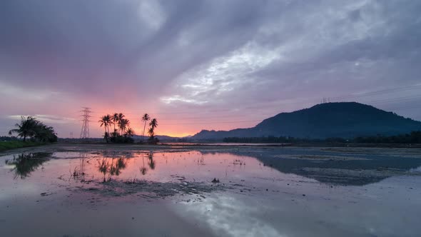 Timelapse of cloudy day at rural farm alt