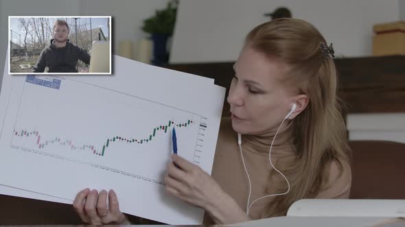Blond Charming Woman Explaining Business Graphs To Young Handsome Man in Online Chat. Caucasian alt