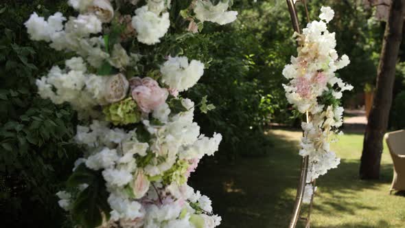 round wedding arch of flowers for the ceremony in the park close-up decor