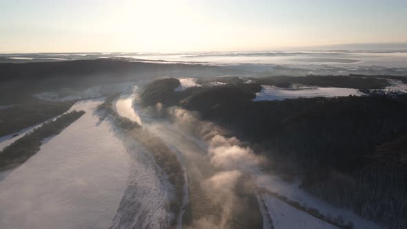 Cinematic Landscape Aerial Horizon View at Sunny Winter Day Early Morning Sunrise Over the River