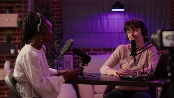 Online Podcast Host Recording Interview in Front of Digital Camera for Vlog Using Professional alt