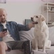 Man with Prosthetic Leg with Dog at Home - VideoHive Item for Sale