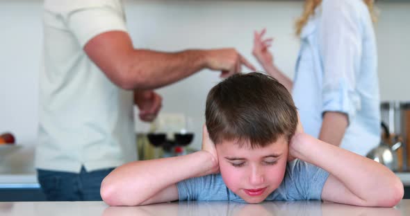 Little Boy Blocking Out Noise From Parents Fighting, Stock Footage