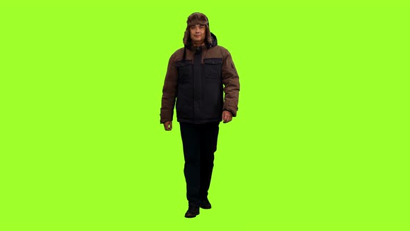 Walking Adult Man in Winter Jacket and Hat 