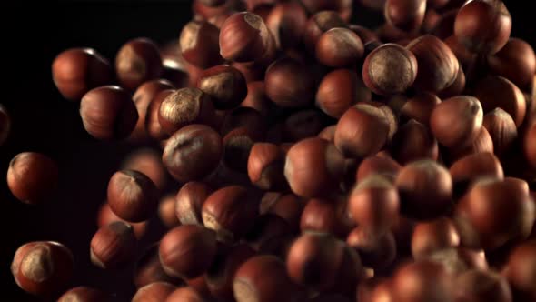 Super Slow Motion a Bunch of Hazelnuts Takes Off and Falls alt