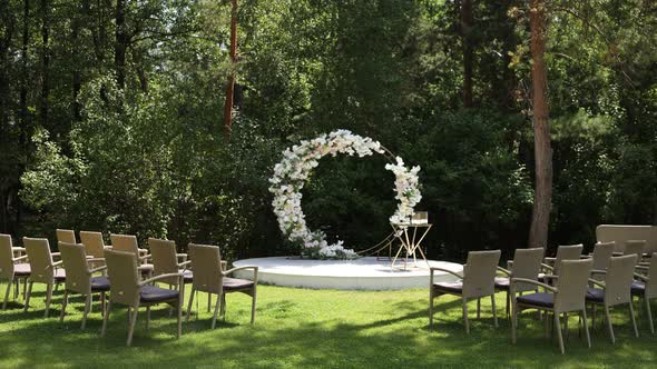 round wedding arch of flowers for the ceremony in the park