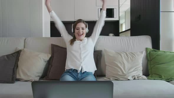 Happy Young Business Woman Enjoy Success Looks At Laptop At Home Office. alt