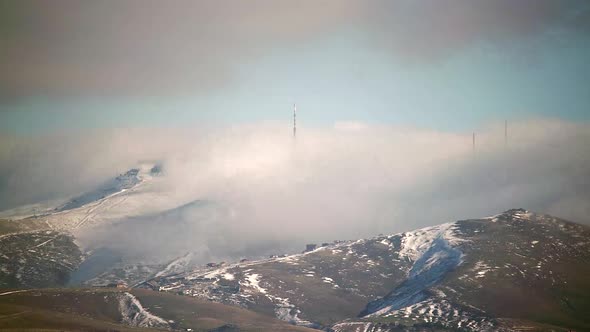 8K Mist Cloud Flowing Down Ridge of Mountain Summit