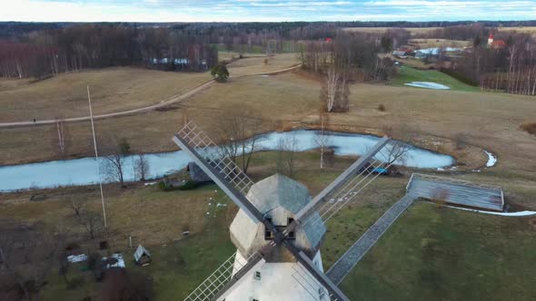 Old Araisi Windmill in Latvia Aerial Shot From Above. Winter Day at Sunrise 4K Video alt