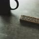 Wooden Piece With Success Falls On The Table - VideoHive Item for Sale