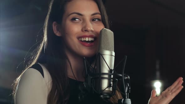 Singer Standing in Front of a Microphone and Singing, Stock Footage