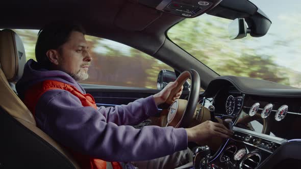 The driver driving the car turns on the map on the control panel.