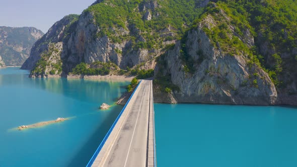 Aerial View on Bridge Over Lake Piva with Mountains in the Background in Montenegro alt