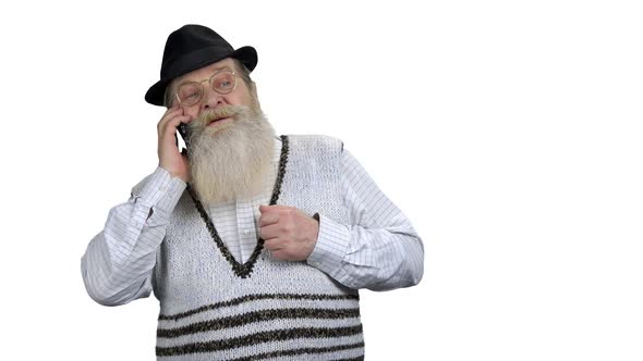 Serious Old Man Talking on Cell Phone alt