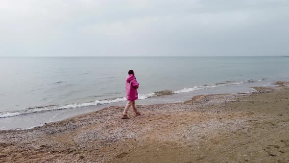 Walking Along the Beach in Cold Weather