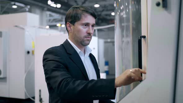 Portrait of a Professional Engineer of Heavy Industry Dressed in a Protective Uniform Safety Glasses alt