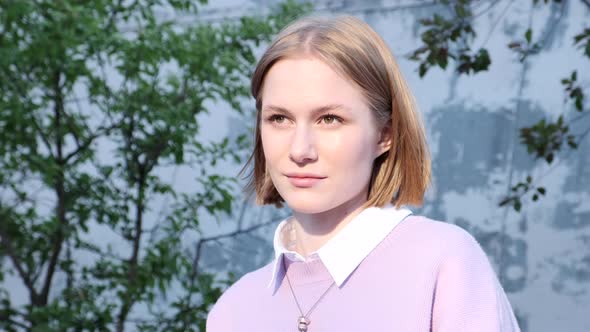 Professional Model with Short Fair Hair Waved By Light Wind alt