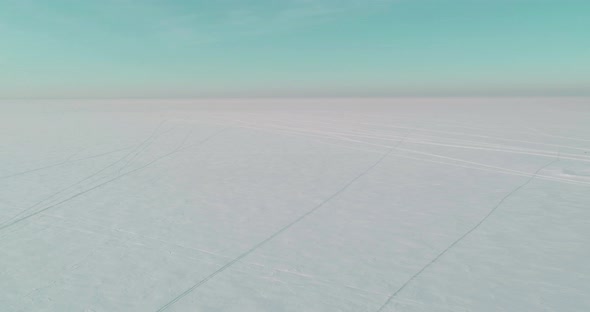 Aerial View of Cold Winter Landscape Arctic Field Trees Covered with Frost Snow Ice River and Sun alt