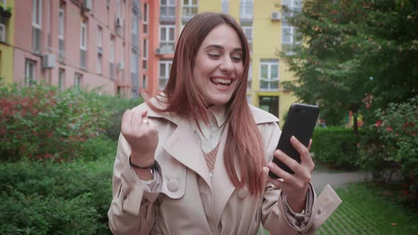 Young Happy Amazed Woman Receive Good Message Use Phone Wow Surprise New alt
