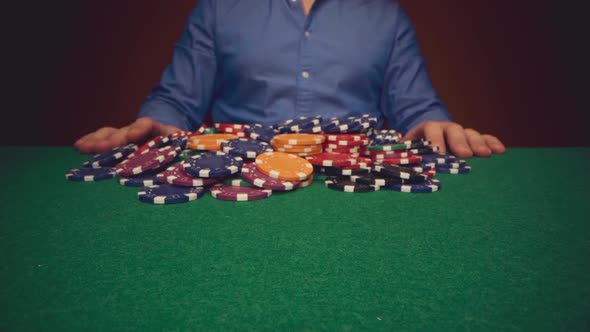 Male Player Betting All Chips in While Playing in Casino Close Up