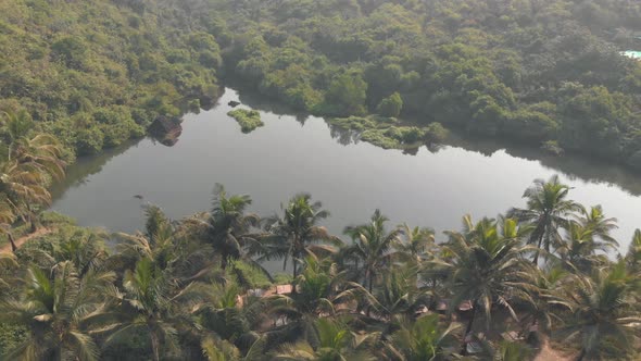 Sweet Lake on Arambol beach, Goa, India. Aerial establishing shot alt