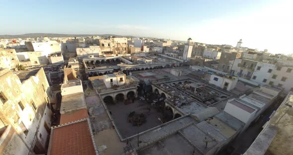 Fishmarket, also named spice market in Essaouira Morocco in a time lapse under overcast clouds alt