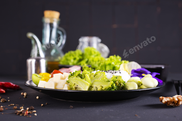 Rice and broccoli served on a plate on dark background - Stock Photo - Images