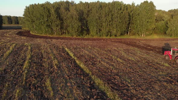 Farm Machinery Plowing Field alt