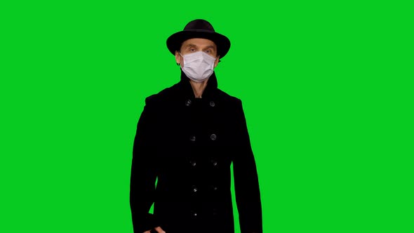 Elegant Man In Protective Mask During COVID-19 Pandemic on Green Screen