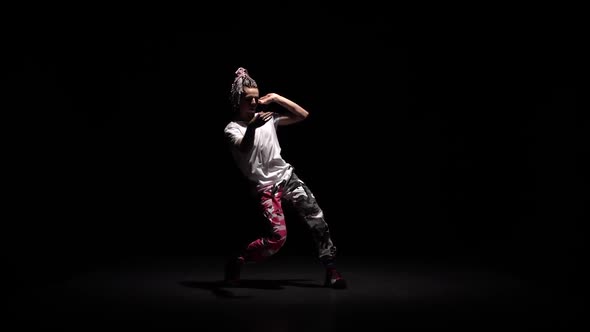 Professional Young Hip-hop Dancer, Dancing in Dark Studio in the Fog. Hip Hop Culture. Rehearsal alt