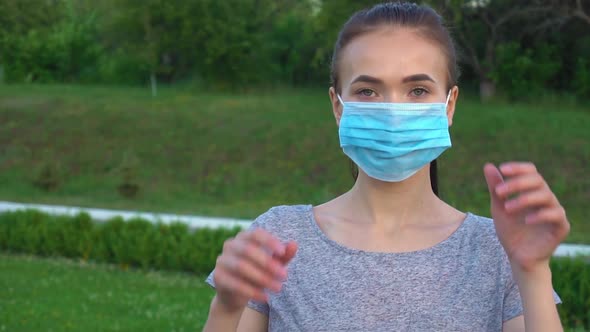 Portrait of a Young Woman Wearing Protective Mask on Street