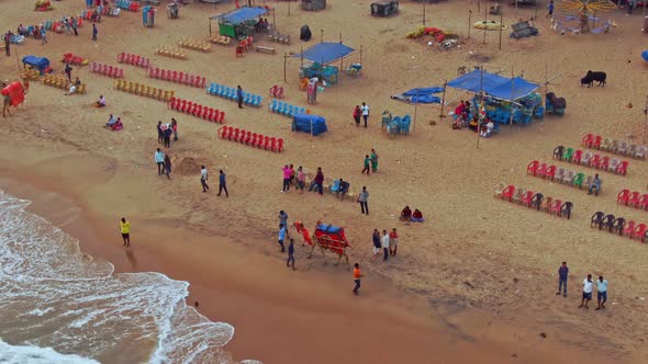 Aerial view of a crowded beach in India, Puri, Orissa. 4k alt