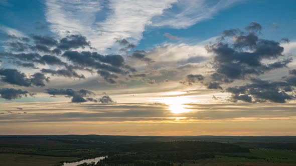 Beautiful Dramatic Fast Lapse Time of Sunset and Clouds in the Blue Orange Sky alt