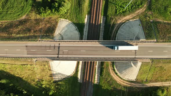 Car Road Junction With Bridge And Railway Under It Aerial Top View At Sunny Day