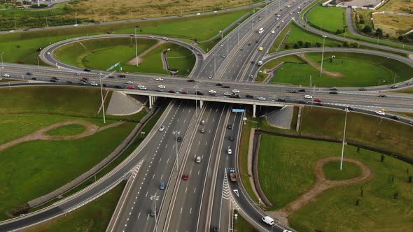 Autos Drive Along Highway Multilevel Traffic Intersection alt