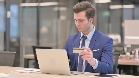 Businessman Making Online Payment Failure on Laptop in Office alt