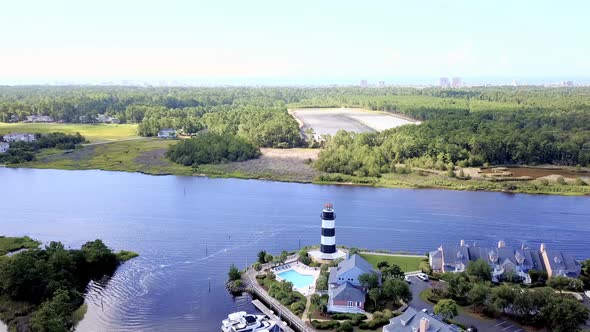 Aerial view of marina with lighthouse in South Carolina. alt