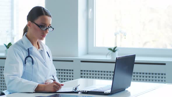 Professional medical doctors working in hospital office making research. alt