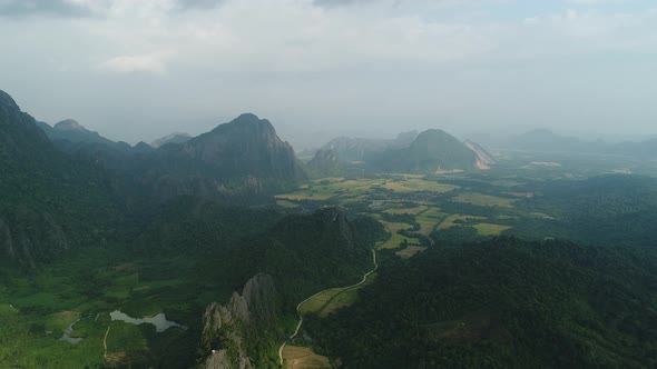 Nature landscape near town of Vang Vieng in Laos seen from the sky alt