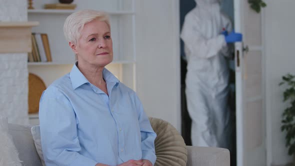 Old Elderly Grayhaired Woman Sick Lady Sits at Home Sofa on Selfisolation During Pandemic Quarantine alt