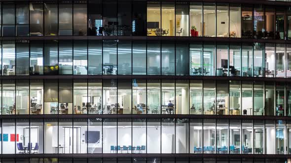 Office windows in the business center in the evening